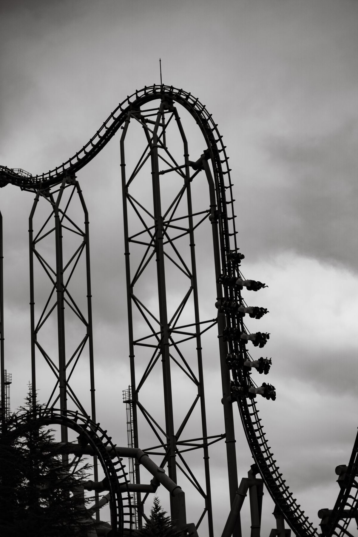 Steel roller-coaster track against the sky