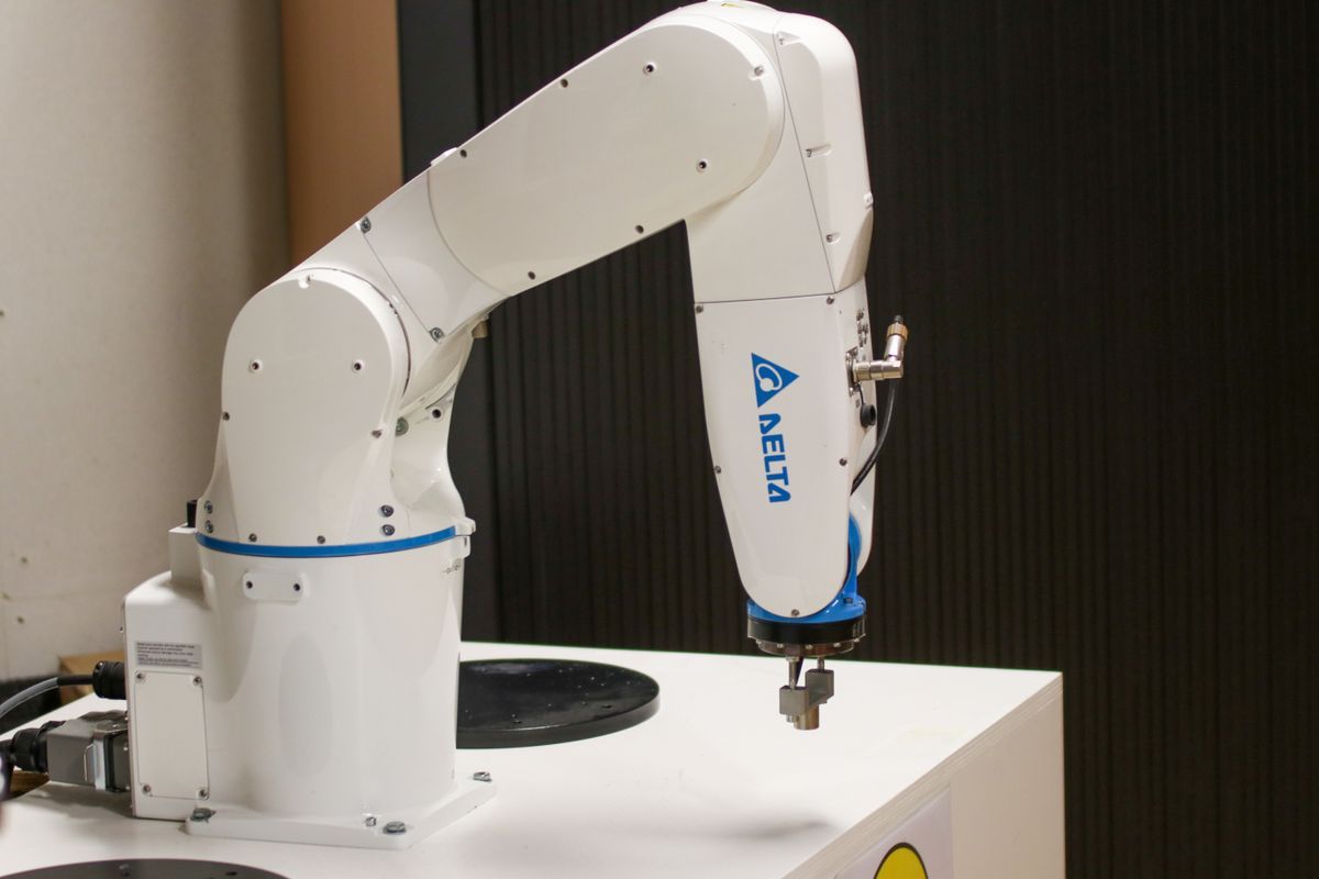 Industrial robotic arm on a work cell