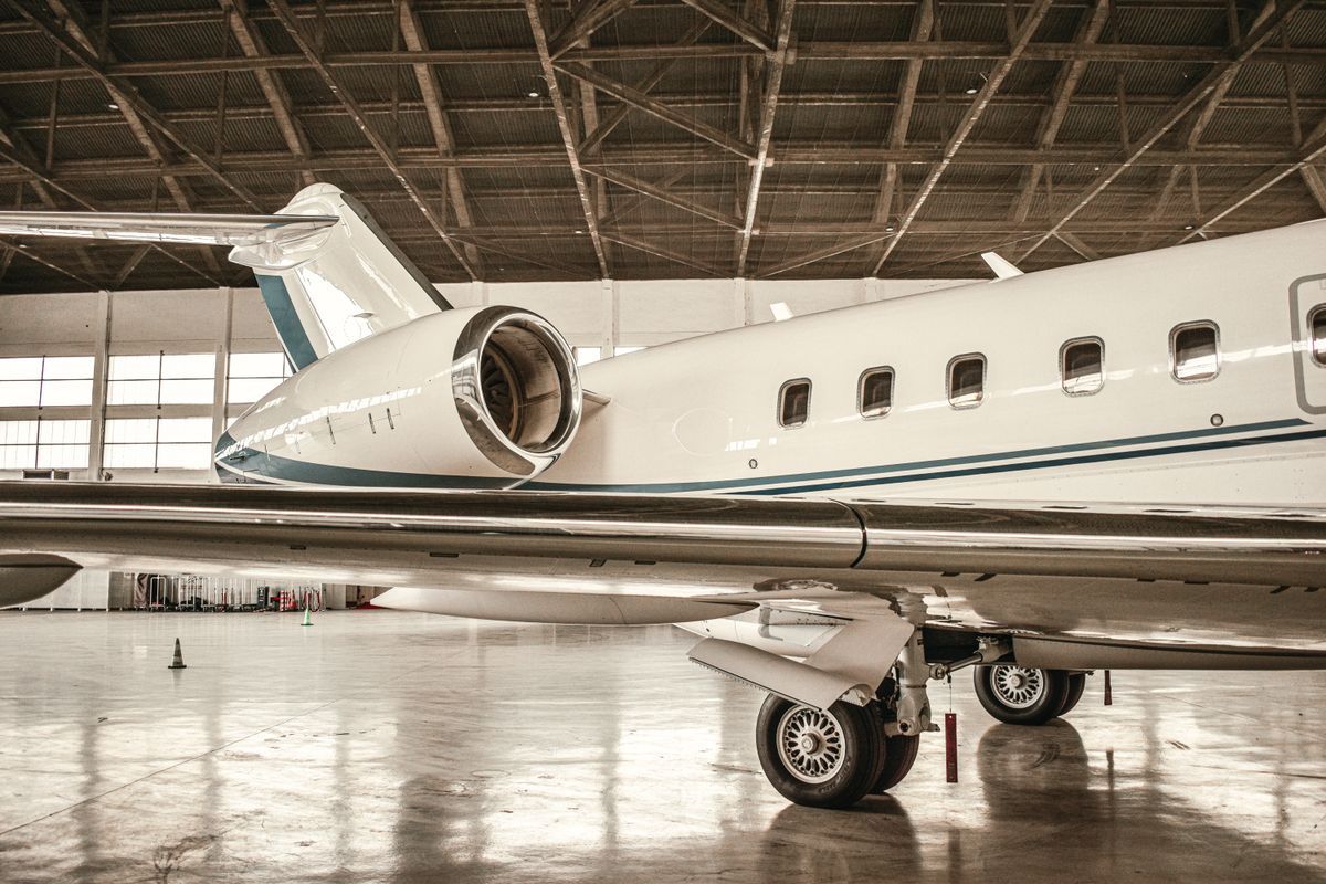Business jet parked in a hangar