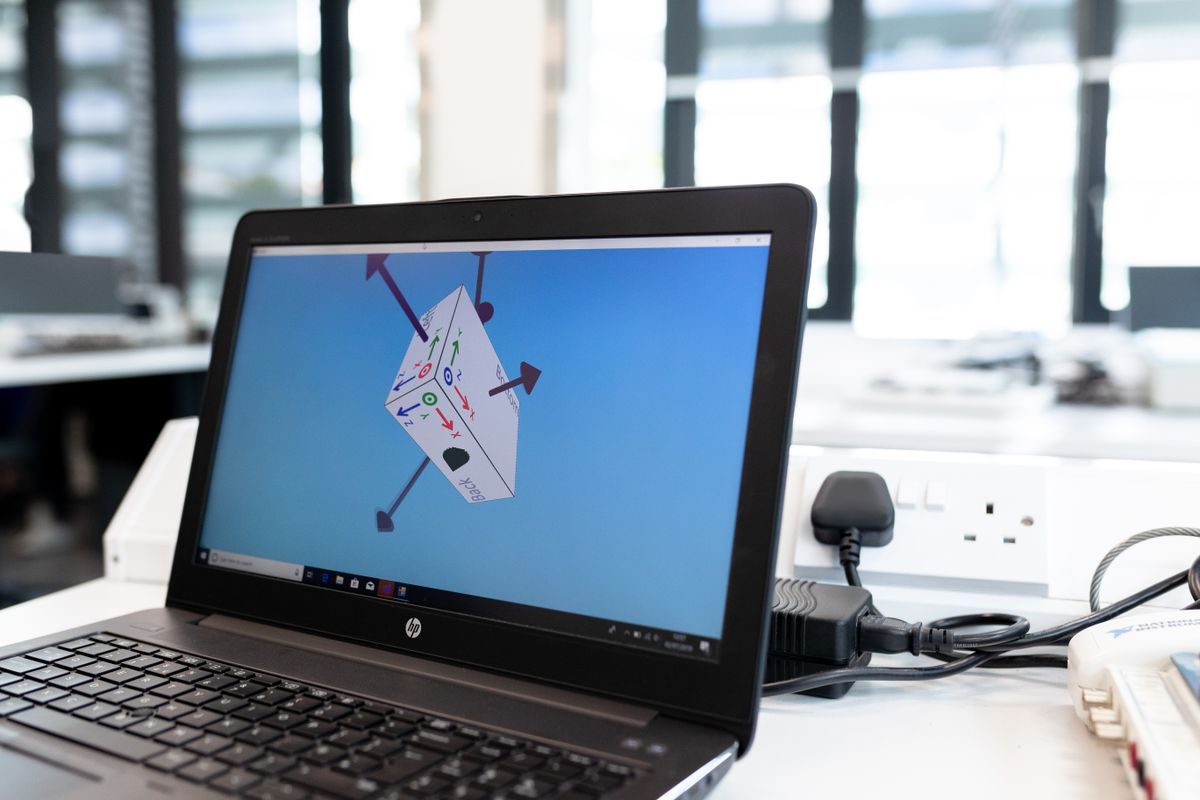 3D CAD model of a part on a laptop screen