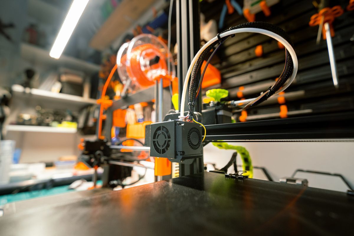 3D printer building a prototype in a workshop