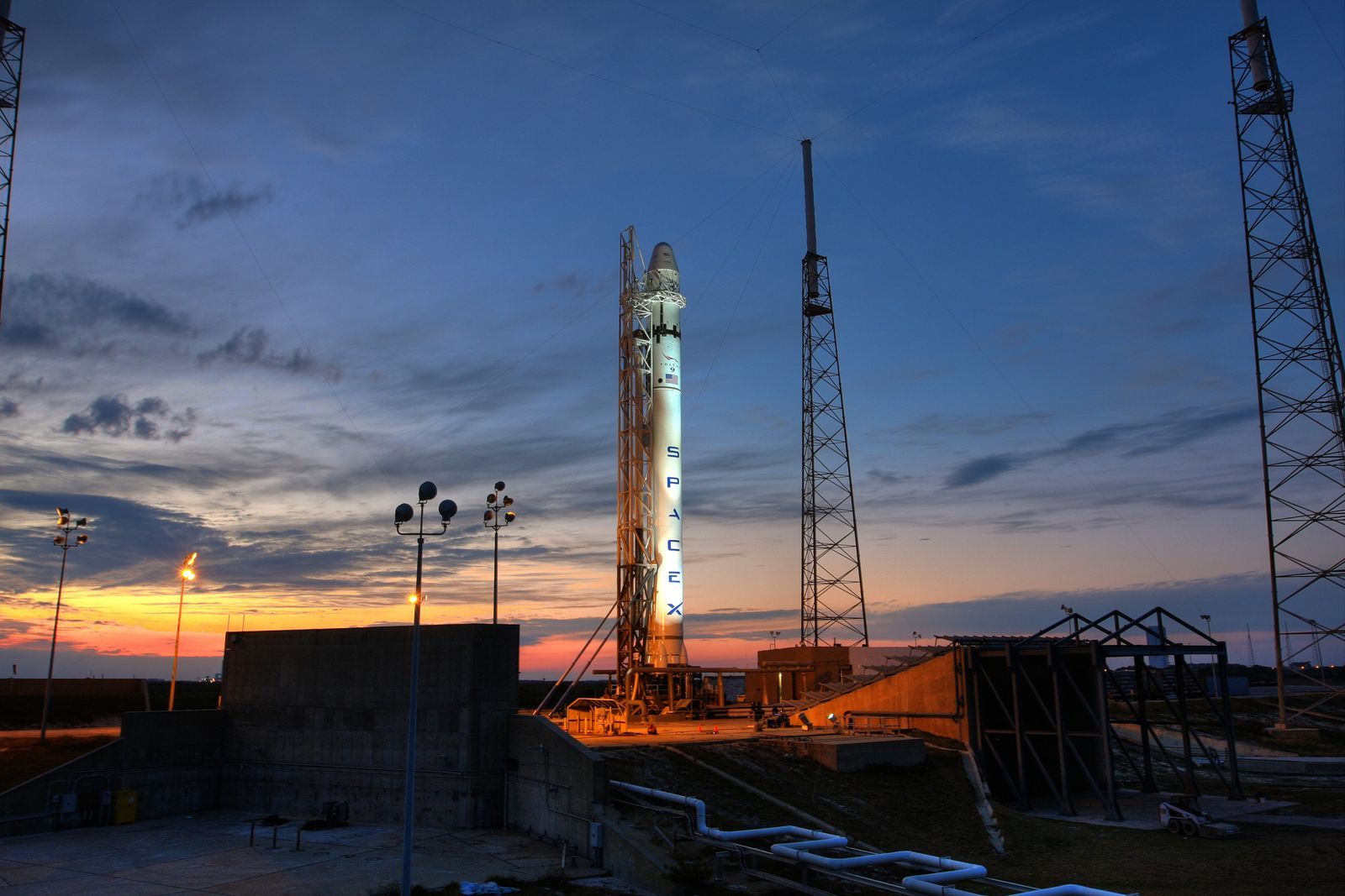 Rocket on a launch pad at dusk